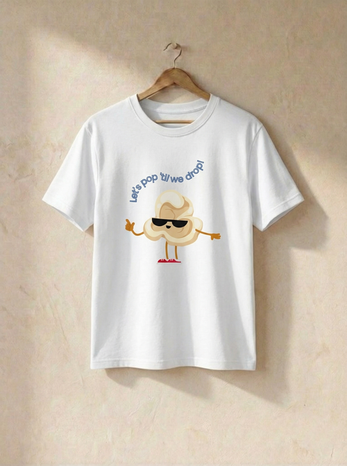 White t-shirt with cartoon design and text on a beige background