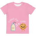 Pink t-shirt with cartoon milk bottle and cookie design on a white background