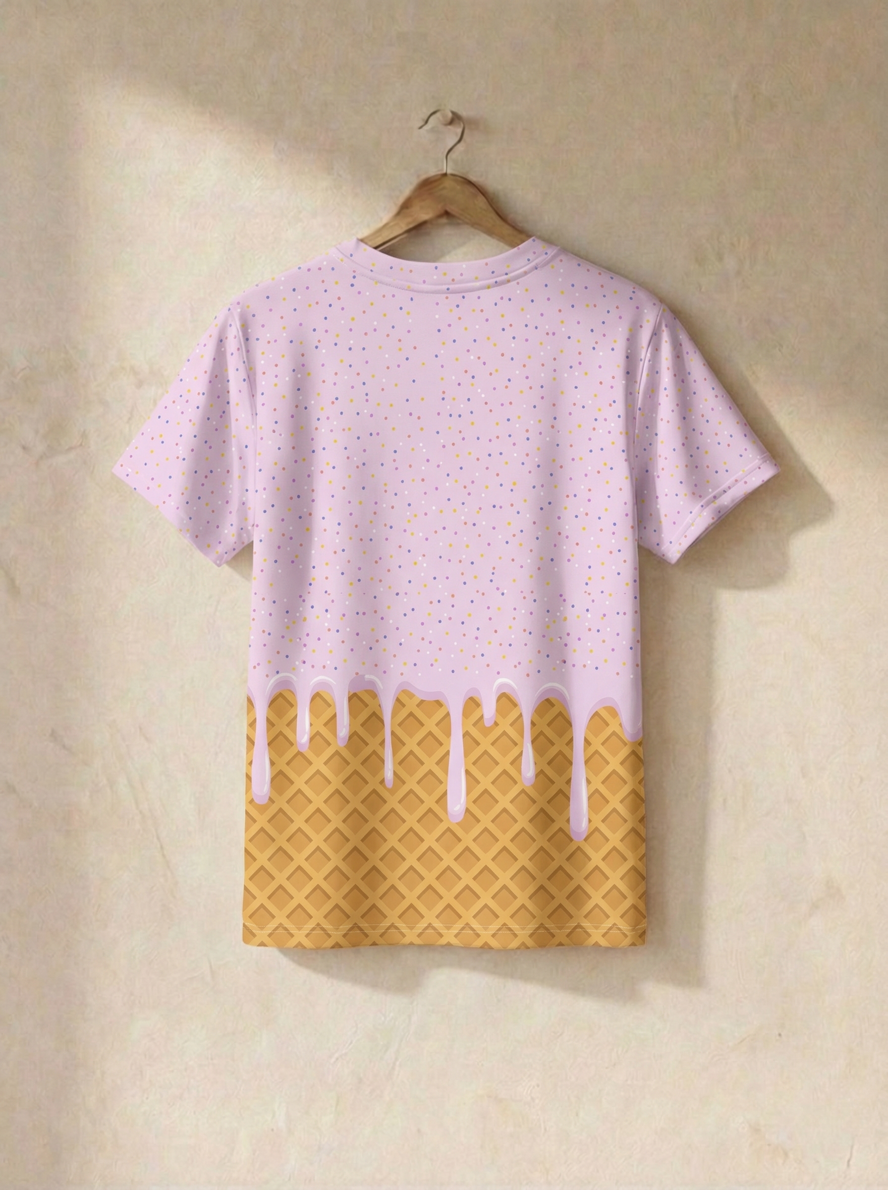 Pink t-shirt with ice cream cone design on a beige background
